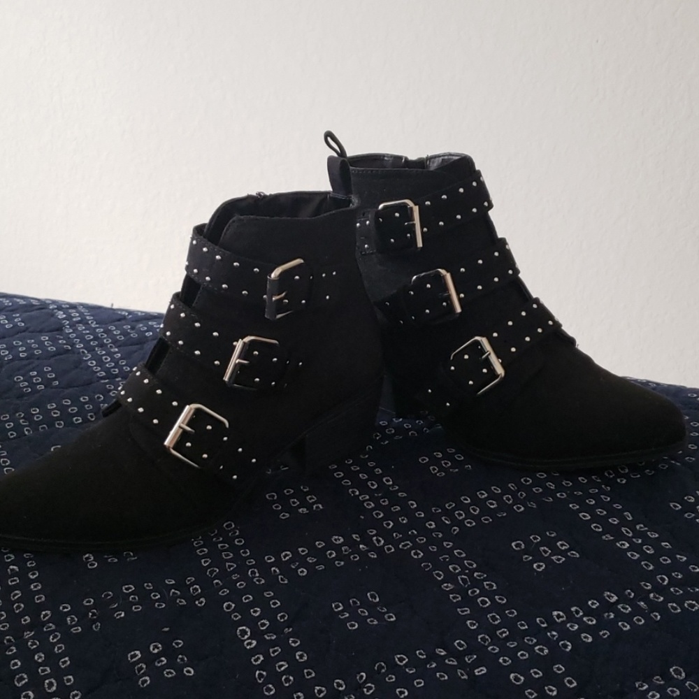 Black booties with silver buckles